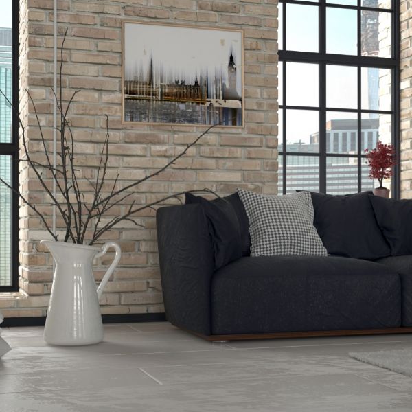 Modern living room with exposed brick wall and warm interior lighting
