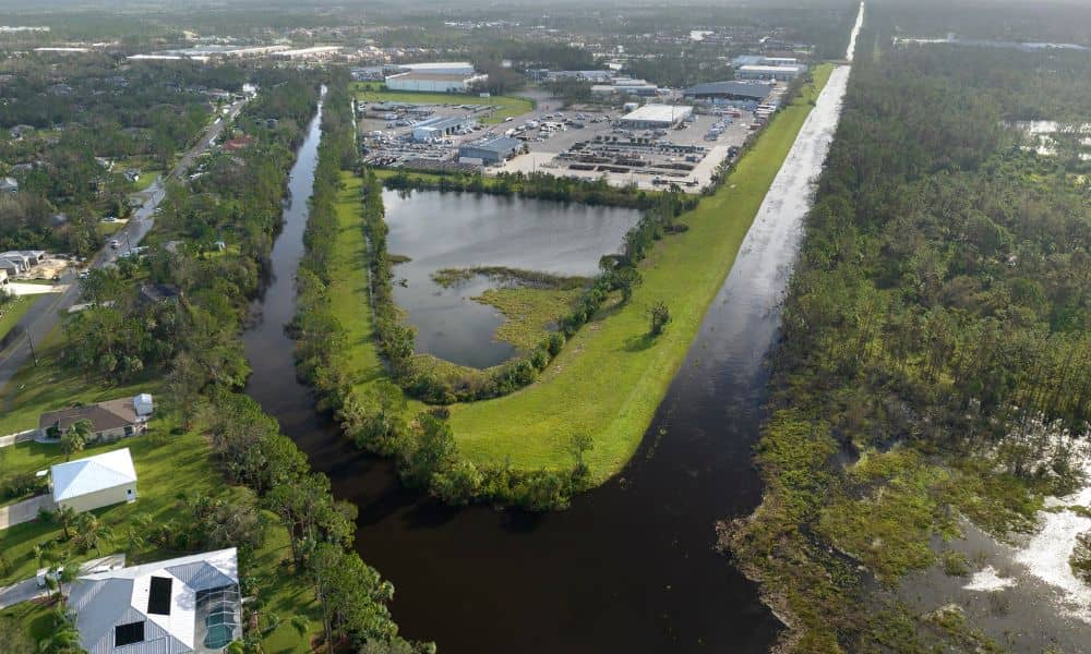 Aerial view of homes and drainage canals showing flood risk and the need for a FEMA elevation certificate