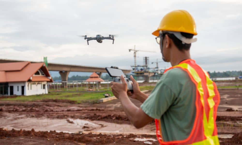 Drone surveying in progress over an active construction site