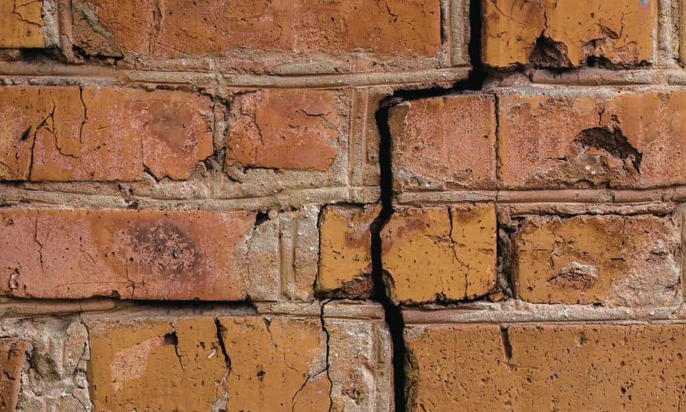 Stair-step cracking in a brick wall that a professional brickmason would recognize as a sign of structural movement